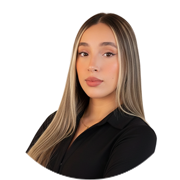 A person wearing a blue checkered sleeve smiling.